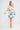 Porto Dress Perfect French true wrap style short dress featuring a V-shaped neckline and waist tie detail shown in a lifestyle view.