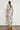 Quote Dress in mint kgari featuring a relaxed shirt dress silhouette, midi length, and button-through design.
