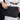 Raffia clutch with crossbody chain in black raffia featuring a gold chain strap and vintage-style gold clasp.