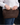 Raffia clutch with crossbody chain in chocolate brown raffia featuring a round vintage-style gold clasp.