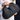 Raffia Clutch with gold chain in black featuring a snap handle closure and woven texture shown in an open view.