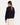 Person wearing a navy blue textured sweater with beige pants on a white background