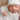 White Ribbed knotted baby beanie featuring a stretchy ribbed cotton blend and top knot.