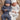Two sleeping twin babies wearing soft ribbed cotton onesies and matching beanies.