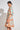 Scenic Dress Spring Glow shown from the side profile highlighting the fit-and-flare cut and knee length.
