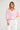 Seaside Top Candy Stripe featuring soft gathered detailing and raglan sleeves with shirred cuffs.
