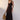 Senne Dress Chocolate front view featuring a viscose blend yarn, wider ribbed detailing below the bust, and a full silhouette.
