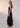 Senne Dress Chocolate side view featuring a body skimming silhouette in a fitted ribbed knit maxi length.
