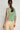 Back view of the Sense Vest in apple green, highlighting the clean tailored back, sleeveless cut, and 100% polyester relaxed-fit.
