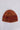 Front flat lay view of the Solver Beanie in spice featuring a cosy ribbed texture and classic fitted silhouette.