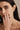 Lifestyle portrait of a model wearing the gold-plated Sophia Ring stacked with another ring.