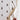 Stretch swaddle featuring a hand-illustrated teddy bear design shown unfolded to reveal the breathable stretch fabric.