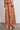 Surge Pant Truffle featuring a cropped wide-leg silhouette in cotton lace shown from the back.