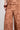 Surge Pant Truffle featuring a close-up of the intricate cotton lace texture and pattern.