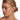 Model wearing the Teddie gold triple hoop huggies with sensitive-ear friendly stainless steel posts.