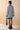 Back view of The Ada cotton knit dress showcasing the 12-gauge patterned knit and ribbed hem.