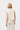 Back view of the Kireina Amy Vest in Sand. Styled as a triple-denim look from The White Place Australia.