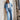 Model wearing the Kireina Harper Jean in Ribbed Mid Blue with a matching shirt. Shop the look at boutique stockist The White Place.