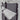 Textile throw with fringes on a light gray background