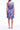 Tia Valencia Dress crafted from 100% hemp featuring a vibrant blue and red floral print shown in a back product view.