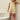 Front view of the reversible Tiki overalls in the island-girl art print with a front patch pocket and button straps.