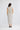 Turning Point Dress in Ivory Spot shown from the back, featuring a back keyhole with button closure and a shirred back waist panel.