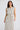 Turning Point Dress in Ivory Spot crafted from printed satin fabric with a regular fit silhouette.