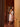 Tweed Bath Towel in Nougat lifestyle shot featuring a model in a bathroom environment.