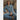 Woman wearing a denim outfit sitting on a beige couch.