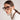 Tortoise shell polycarbonate reading glasses styled with a matching chunky chain strap.