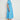 Valour Dress Lagoon shown from the side profile highlighting the feminine curved hem and relaxed midi fit.