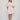 Virginia Mini Dress Baby Pink shown in a full length view with a relaxed mini length silhouette.