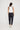 Wayfarer Pant in Navy shown from the back, featuring back patch pockets and a regular fit tapered silhouette.