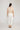Wayfarer Pant White featuring stretch drill fabric and a streamlined shape viewed from the back.