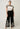 Willow Linen Embroidery Pant Black model view highlighting the flattering wide-leg fit and detailed embroidery.