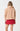 Xena Pullover Tan back view highlighting the red badge logo at the back neck and relaxed fit.