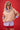 Xena Pullover Tan styled in a lifestyle view featuring a funnel neck spray pullover over a striped shirt with a functional front zip.