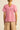 Back view of the Yonder Top in floss pink, featuring gathered shoulders for soft sleeve volume, ladder-lace inserts, and a relaxed silhouette.