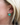 Zinnia Flower hoop earring featuring a bold green enamel flower design worn by a model.